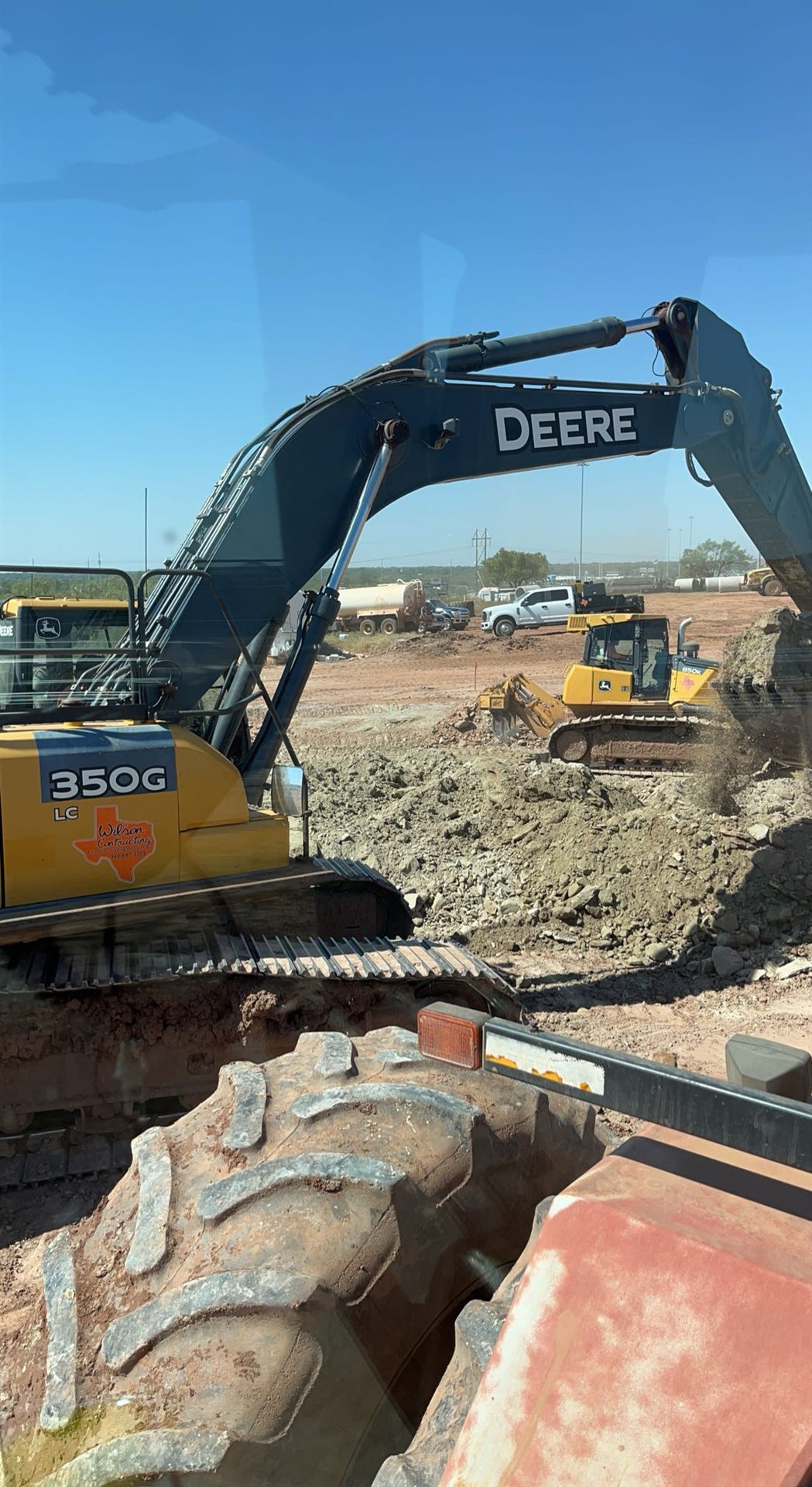 Wilson Contracting excavator loading a dump truck