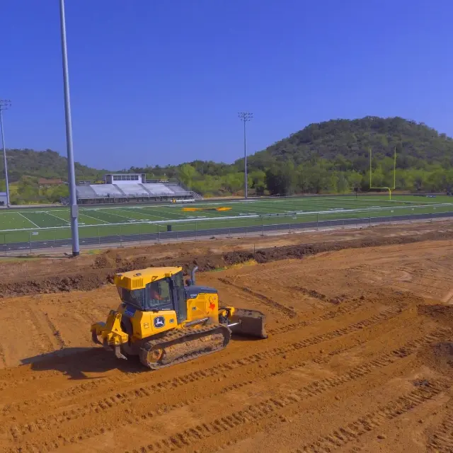 Wilson Contracting dozer grading a site beside a sports field
